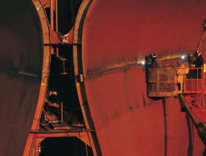 Welder performing welding in a confined space using the Mecaweld Nano Series borescope welding camera for real-time weld monitoring